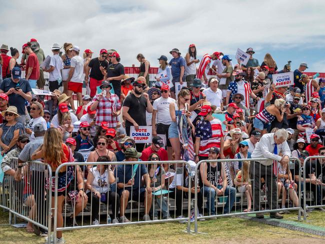 Ron Wagner, 68, (R) tries to keep cool while waiting for Republican presidential candidate, former US President Donald Trump's arrival ahead of a campaign rally. Picture: Brandon Bell/Getty Images/AFP