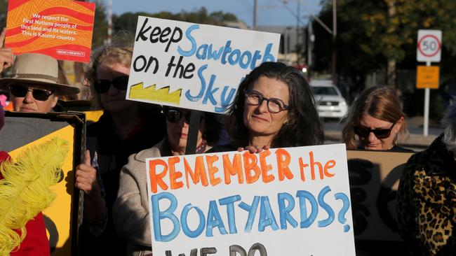 Protesters, in a last-ditch effort to save the old dockyard at Fletcher’s Slip, at the site on Tuesday. Photo; AAP Image/Kelly Barnes. 