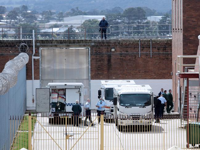 Inmates being brought into the jail. Each prisoner fills out a form, noting their associations and “enemies”. Picture: Tim Hunter