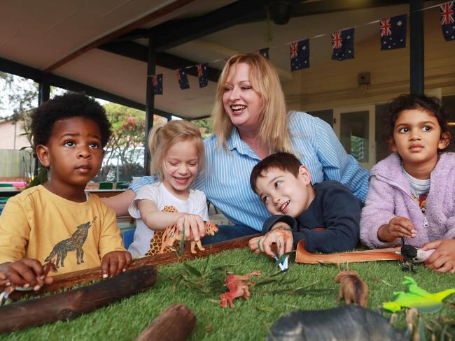 BUDGET 202220/10/22: Australian Childcare Alliance vice-president Nesha Hutchinson with Hendrix(dark skin), Ava (blonde), Mia and Mitchell at her childcare centre in Sydney. John Feder/The Australian.