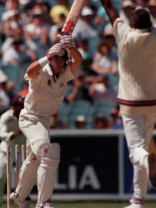 Matthew Hayden is bowled by Curtly Ambrose in 1996.