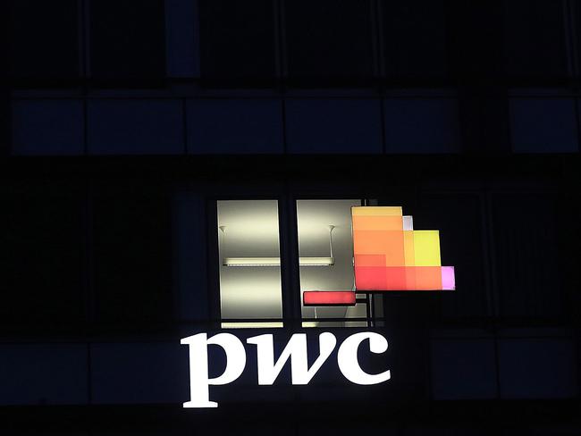 A logo sits illuminated on the offices of Pricewaterhouse Coopers International Ltd. (PwC) in Stuttgart, Germany, on Thursday, Jan. 25, 2018. Germany’s Federal Administrative Court in February will rule on a potential diesel ban in Stuttgart, with consequences likely for other polluted cities. Photographer: Krisztian Bocsi/Bloomberg