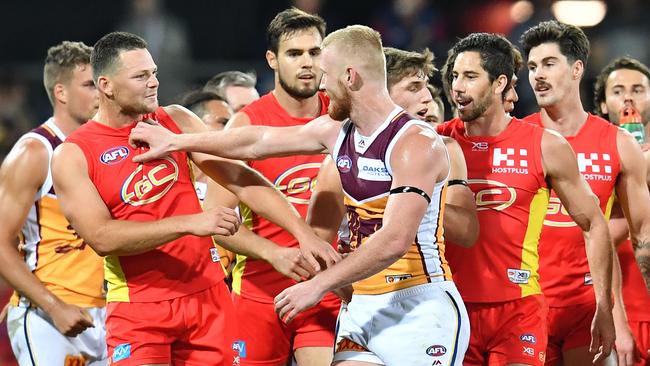 Steven May and Nick Robertson enjoy a push and shove on Saturday night. Pic: AAP