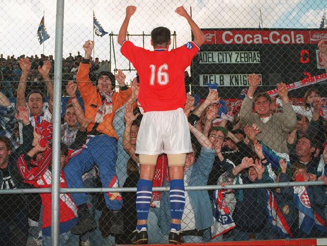 Knights defender Ante Kovacevic, who is now part of Adelaide United’s football operations, celebrates the grand final win with thousands of travelling fans at Hindmarsh Stadium.