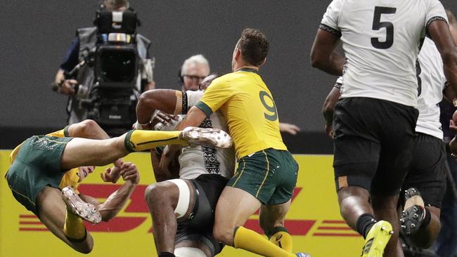 Australia's Reece Hodge (left) flies off Fiji’s Peleci Yato. Hodge has copped a three-match ban for the contact. Picture: AP