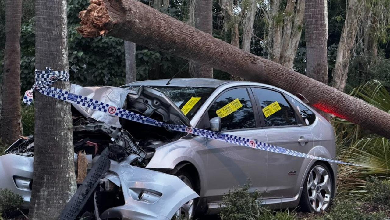 Police tape surrounds the wreckage of a silver hatchback which smashed into threes at Twin Waters. PHOTOS: Mark Furler