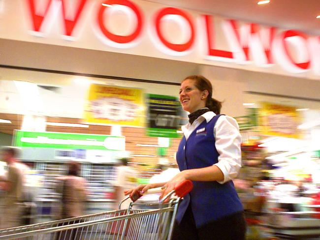 103/Generic of worker with a trolley at Woolworths supermarket. retail food stores supermarkets.