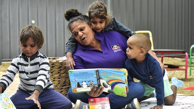 Earling learning educator Browyn Feilding with Tayshaun Haines ,4, Ethel Impu ,3, and Elijih Arabie, 4, at the Pre-School Readiness Program, in Alice Springs.