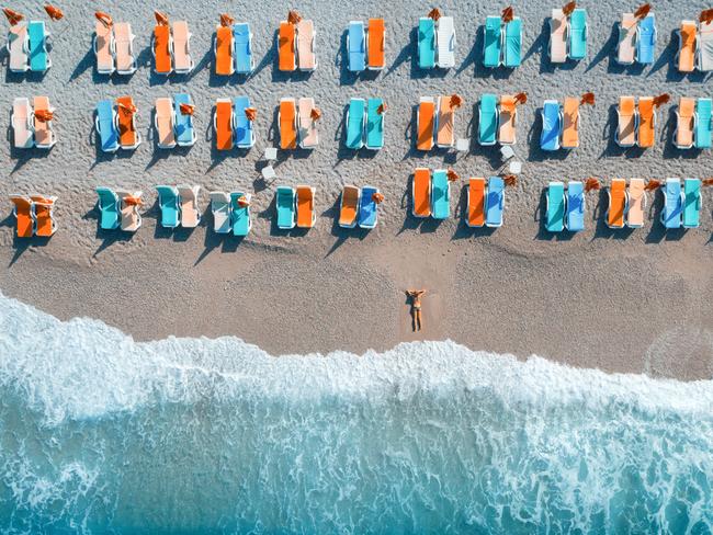 Young woman on the sea at sunrise in Oludeniz, Turkey. Picture: Supplied