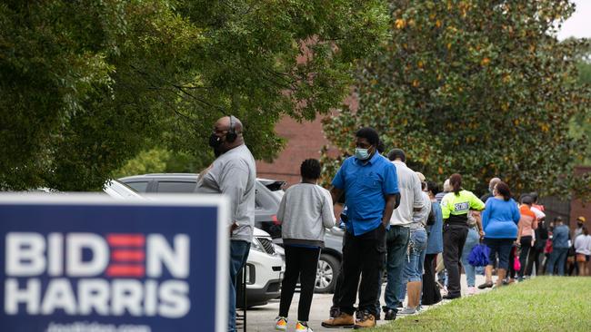 People stand in line in Atlanta, Georgia, on the first day of early voting for the US election. Picture: AFP