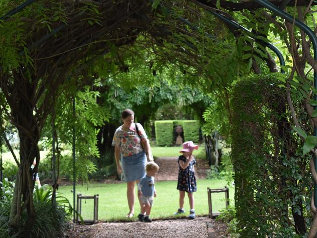 Visitors enjoy 54 Lock Street's enchanting garden at the Apple and Grape Festival. February 25, 2024