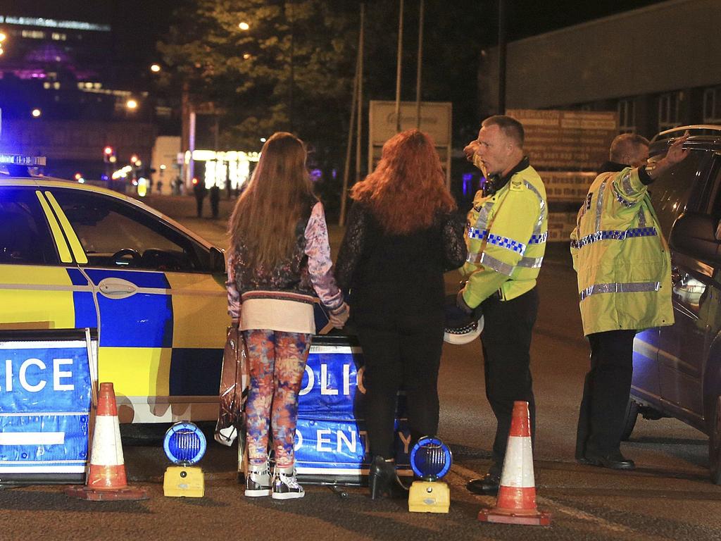 Police work at Manchester Arena after reports of an explosion at the venue during an Ariana Grande concert. Picture: AP