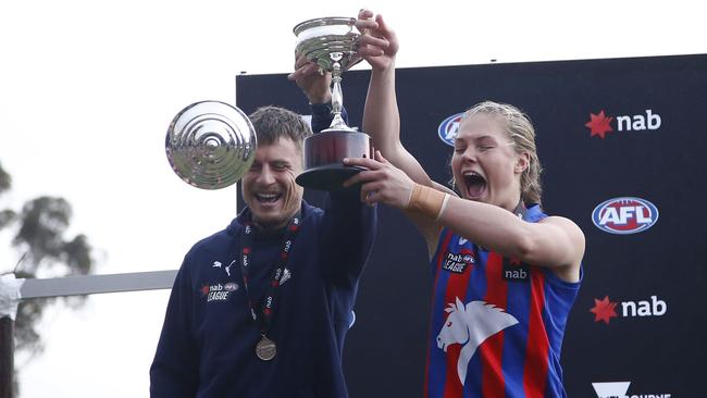 Coach Jason Davenport and skipper Charlie Rowbottom hold the cup aloft. Picture: AFL Women’s