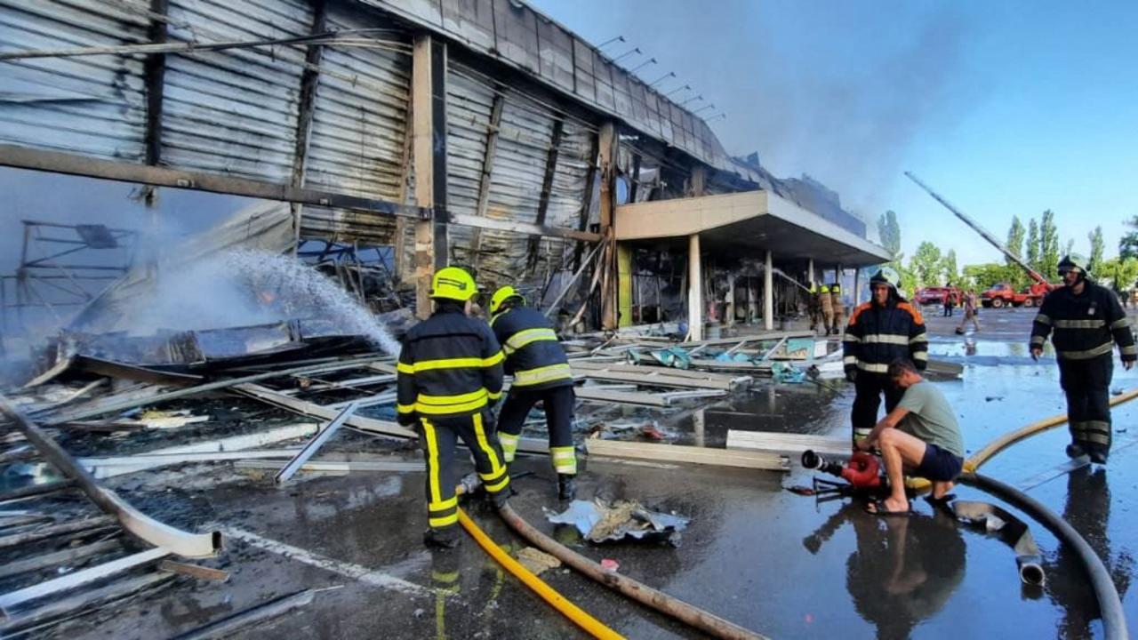 Firefighters putting out the fire in a mall hit by a Russian missile strike in the eastern Ukrainian city of Kremenchuk. Picture: AFP