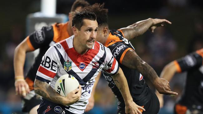 Roosters Mitchell Pearce on the way to scoring his first try during the Sydney Roosters v Wests Tigers rugby league game at Campbelltown Stadium, Sydney. Picture: Brett Costello