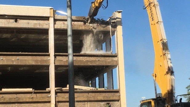 The walls of the old Chan Building opposite Parliament House have started coming down. Picture: Gary Shipway