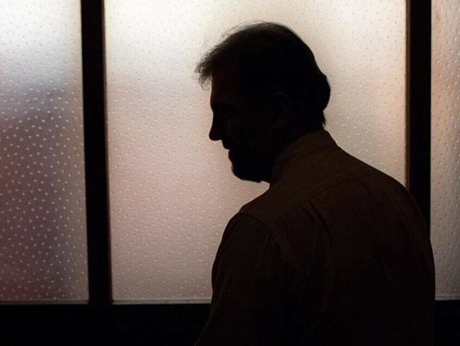 Generic image. Silhouette of a man (parent of) a sex abuse victim in an office. wrongly accused of touching young girl. Child sexual abuse. sex crime incest paedophilia.