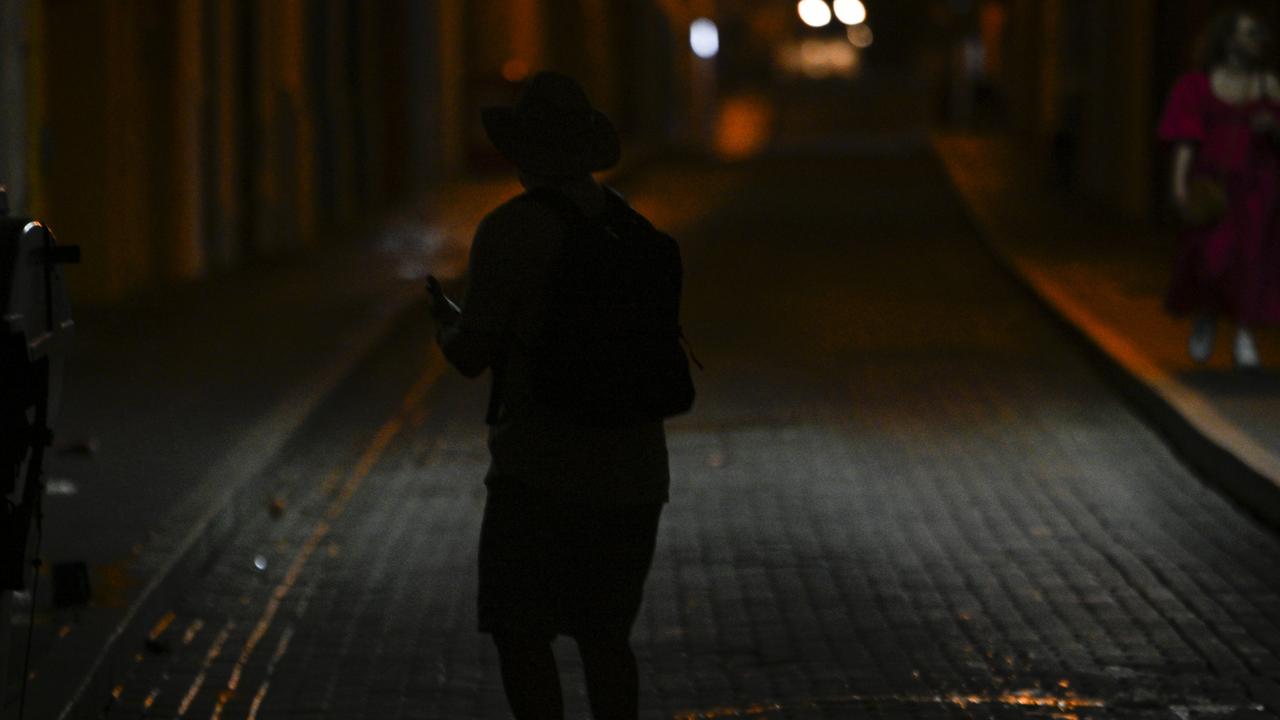 A man walks on a dark street on December 31, 2024 in Puerto Rico’s capital. Picture: by Miguel J. Rodriguez Carrillo/Getty Images