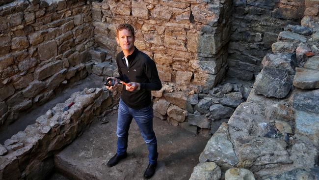 Archaeologist Jeremey Smith in a cottage unearthed at Wesley Place. Picture: Hamish Blair