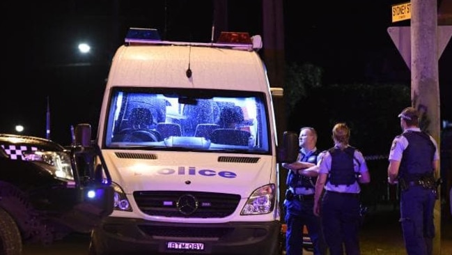 Police at the scene where Mehmet Yilmaz was shot at point-blank range.