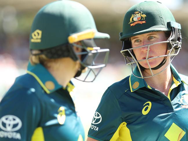 CANBERRA, AUSTRALIA - JANUARY 28:  Alyssa Healy and Beth Mooney of Australia talk before walking out to open the batting during game two of the Women's T20 International series between Australia and South Africa at Manuka Oval on January 28, 2024 in Canberra, Australia. (Photo by Mark Metcalfe/Getty Images)