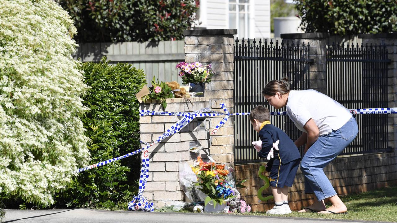 Community members leave floral and soft toy tribute. Picture: Kevin Farmer