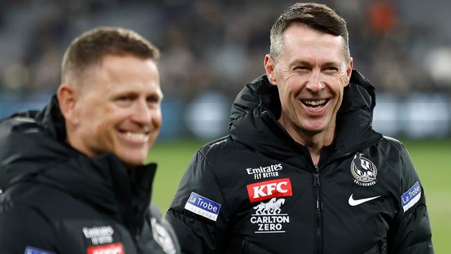 MELBOURNE, AUSTRALIA - MAY 21: (L-R) Hayden Skipworth, Brendon Bolton, Craig McRae and Justin Leppitsch of the Magpies celebrate during the 2023 AFL Round 10 match between the Carlton Blues and the Collingwood Magpies at the Melbourne Cricket Ground on May 21, 2023 in Melbourne, Australia. (Photo by Michael Willson/AFL Photos via Getty Images)