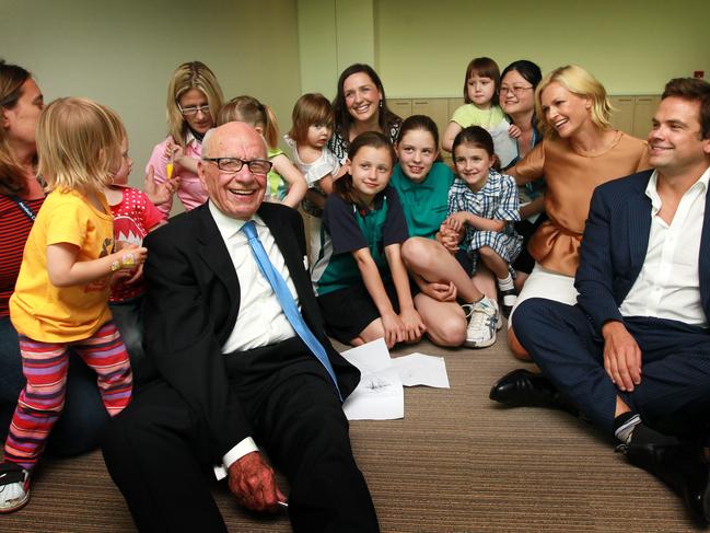 Rupert Murdoch with son Lachlan (far R) and daughter in law Sarah (2nd R) join staff members and their families at the launch of the campaign for the new Murdoch Children's Research Institute in Melbourne, Victoria.