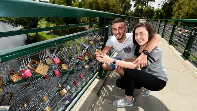 3.2.2016. Couple Shayan Yazarloo and Monique Wright. Adelaide University footbridge which has padlocks locked on it by couples. Photo Sam Wundke