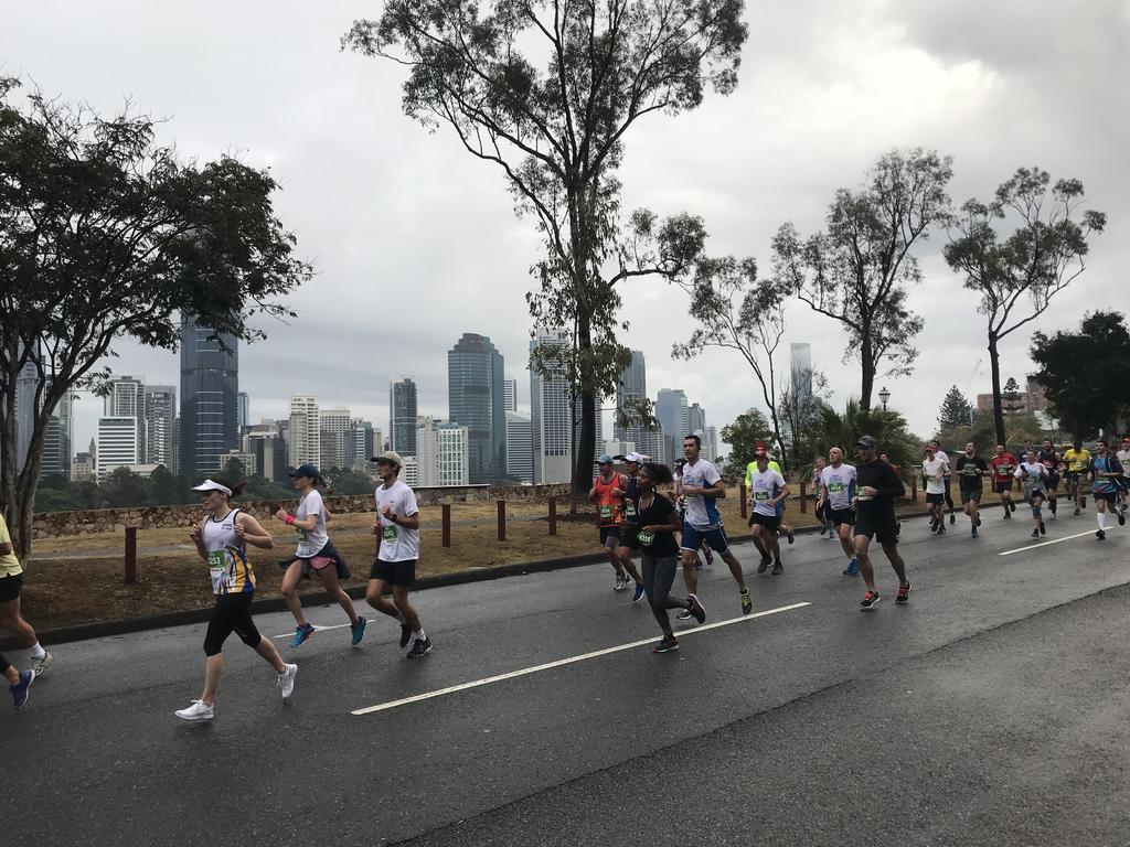 <p>Despite the rain, thousands of runners took part in the Bridge to Brisbane. Picture: Annette Dew</p>