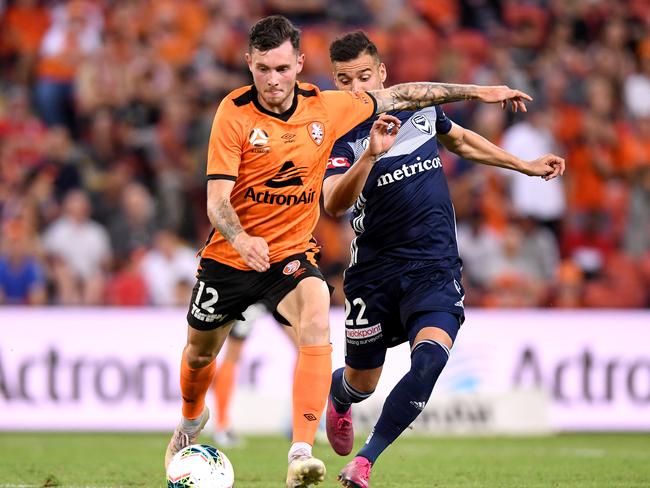 Brisbane’s Aiden O'Neill on the ball ahead of Brisbane’s Kristijan Dobras. Picture: Getty Images