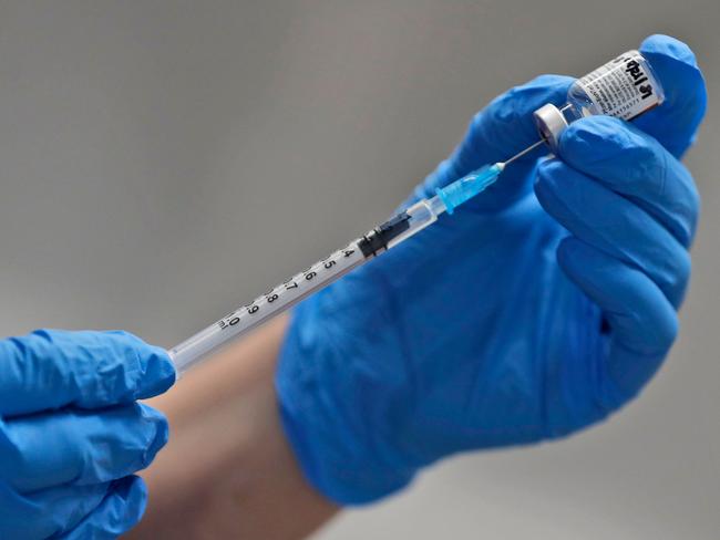 A nurse prepares to administer the Pfizer-BioNTech COVID-19 vaccine  at Guy's Hospital in London, on December 8, 2020. - Britain on December 8 hailed a turning point in the fight against the coronavirus pandemic, as it begins the biggest vaccination programme in the country's history with a new Covid-19 jab. (Photo by Frank Augstein / POOL / AFP)