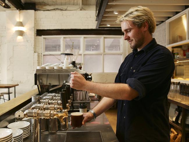 Cam Stephens pouring a nitro coffee at Mecca Coffee, Alexandria, today. (Pic story ahead of International Coffee Day). Picture: Justin Lloyd