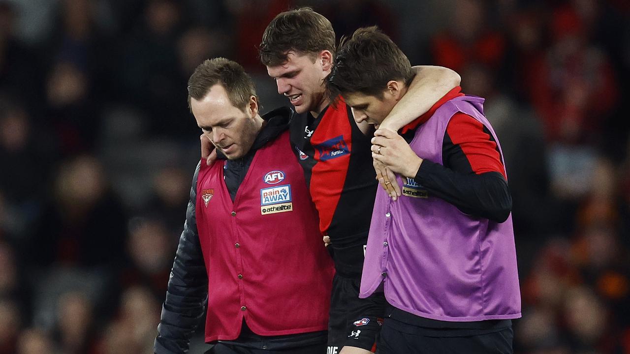 MELBOURNE, AUSTRALIA - JULY 09: Jordan Ridley of the Bombers leaves the field with trainers during the round 17 AFL match between Essendon Bombers and Adelaide Crows at Marvel Stadium, on July 09, 2023, in Melbourne, Australia. (Photo by Daniel Pockett/Getty Images)