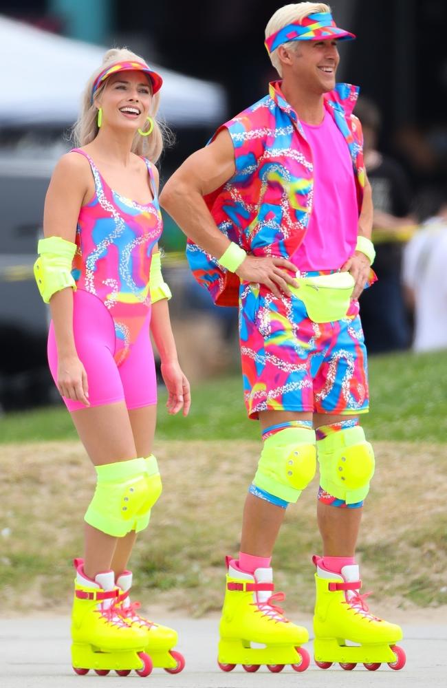 Robbie and Gosling in their neon rollerblading ensembles. Picture: D. Sanchez/Backgrid