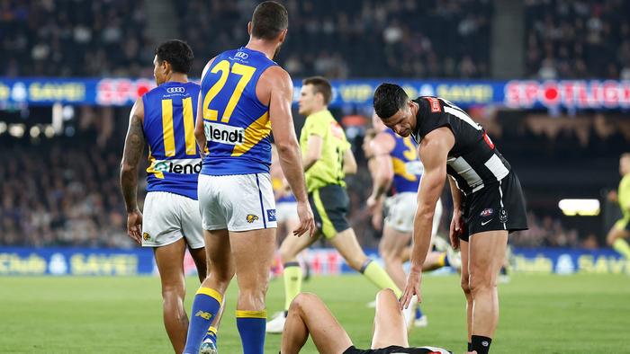 MELBOURNE, AUSTRALIA - MAY 12: Jack Darling of the Eagles checks on Jack Bytel of the Magpies during the 2024 AFL Round 09 match between the Collingwood Magpies and the West Coast Eagles at Marvel Stadium on May 12, 2024 in Melbourne, Australia. (Photo by Michael Willson/AFL Photos via Getty Images)