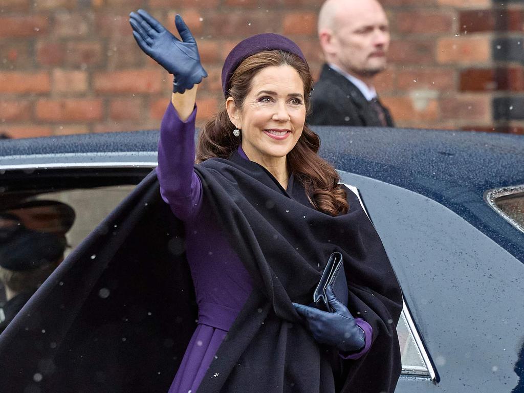 Queen Mary of Denmark greets the crowd as she arrives to a church service on the occasion of the change of throne in Denmark, in Aarhus Cathedral. Picture: AFP