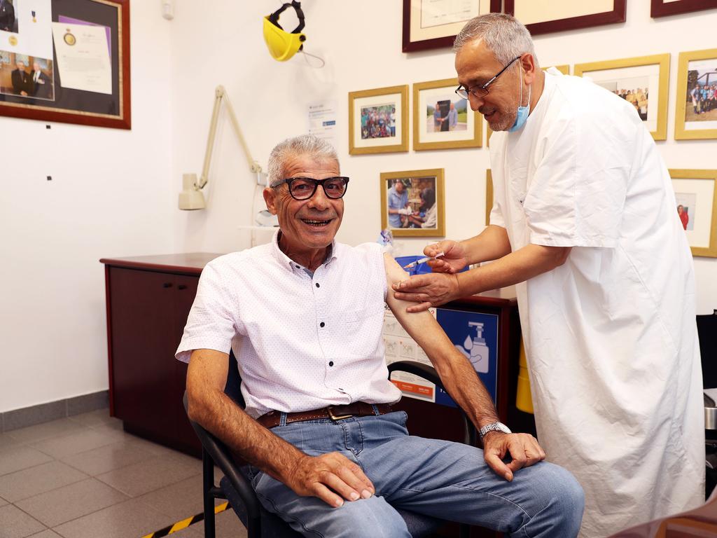 Dr Jamal Rifi administers a COVID-19 vaccine at Belmore Medical Centre. Picture: Tim Hunter