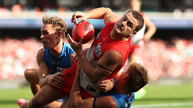 SYDNEY, AUSTRALIA - APRIL 21: Tom Papley of the Swans is tackled by Sam Clohesy of the Suns during the round six AFL match between Sydney Swans and Gold Coast Suns at SCG, on April 21, 2024, in Sydney, Australia. (Photo by Mark Metcalfe/AFL Photos/via Getty Images )