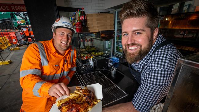 Alan Cook from The Hot Bird in Cheltenham serves level crossing worker Tim Vander Haar. Picture: Jake Nowakowski