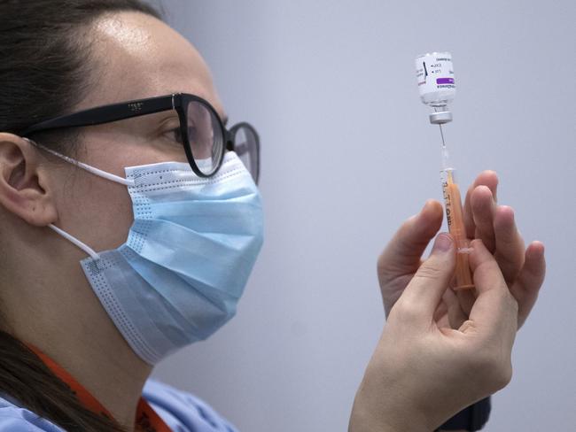 A member of the vaccine team prepares a syringe with a dose of the AstraZeneca/Oxford COVID-19 vaccine. Picture: AFP