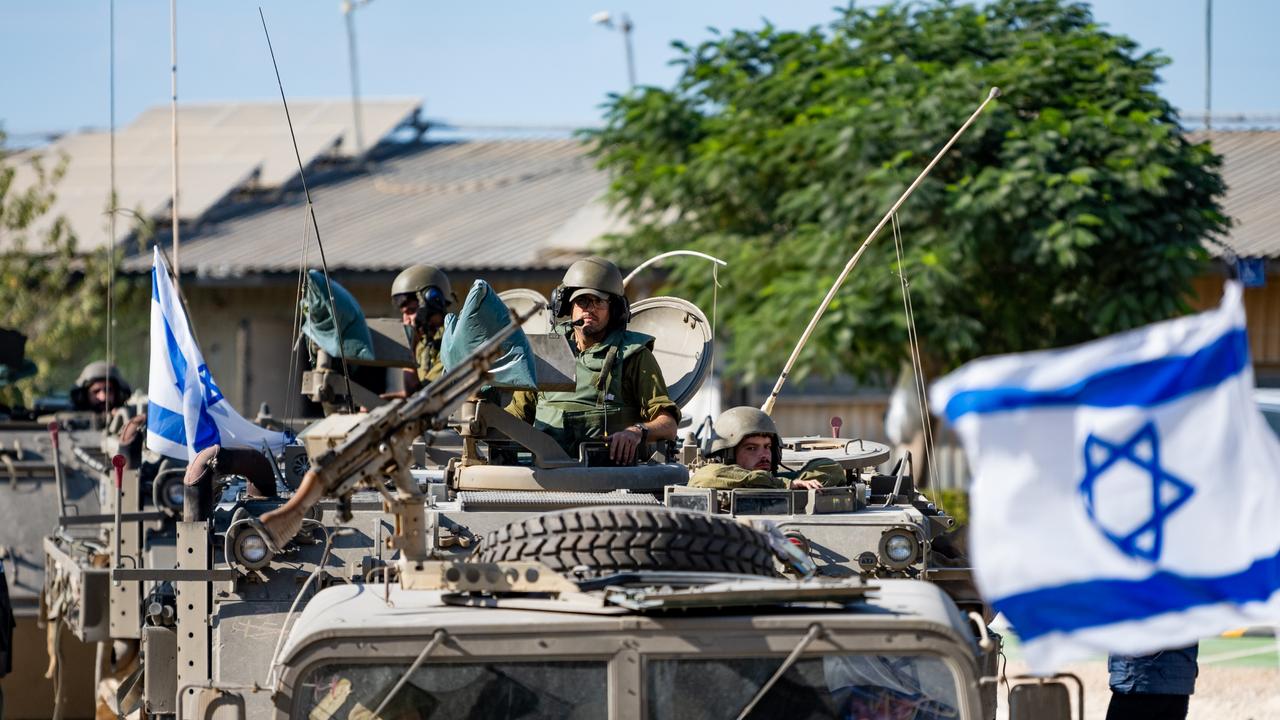 Soldiers ride in armoured personnel carriers on October 17, 2023 in Be'eri, Israel. Picture: Getty Images