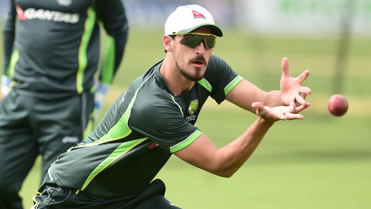 Australia's Mitchell Starc catches the ball during the a nets session at The Spitfire Ground, in Canterbury, England Wednesday June 24, 2015. Australia will play England in the first Test of the Ashes series starting July 8. (Adam Davy PA via AP) UNITED KINGDOM OUT NO SALES NO ARCHIVE