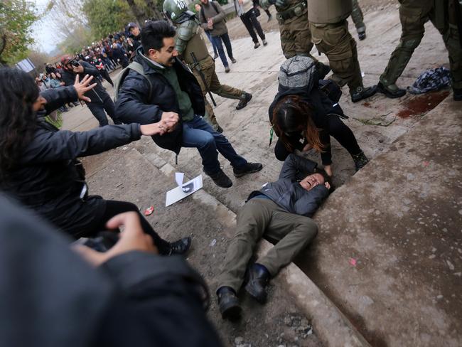 Bloody clashes between demonstrators and riot police clash in Santiago. Picture: AFP