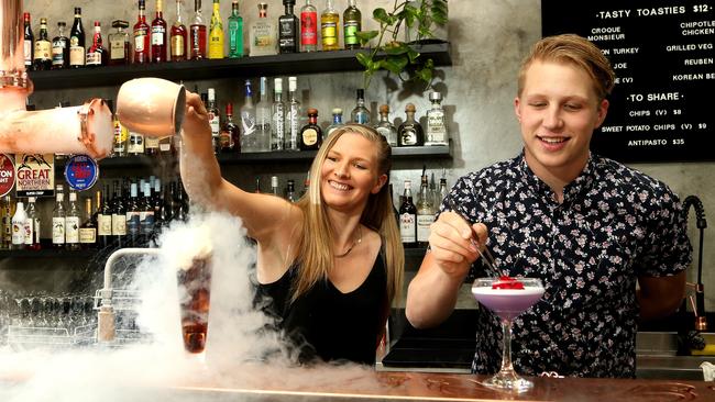 Jess Hadley and Charles Jacob chill out at Ringwood’s Budgie Bar. Picture: Hamish Blair