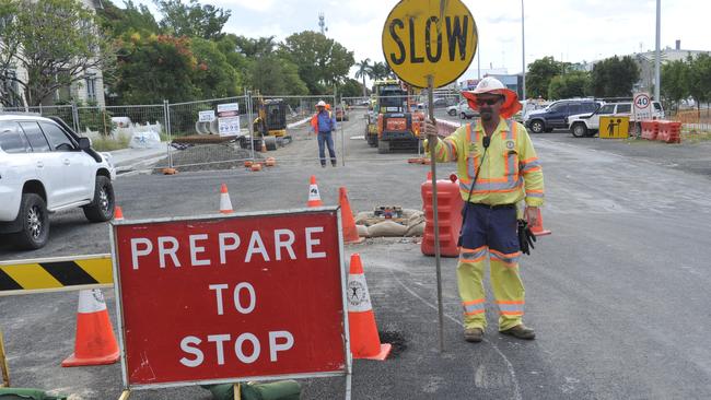 Jerry Dawes from Workforce Road Services controls traffic flow as construction take place for the Clarence Valley's first traffic lights at the intersection of Pound and Clarence streets as part of the new Grafton bridge build.