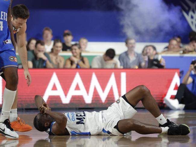 Ian Clark had to be helped from the floor after he was collected by Baynes. Picture: Getty Images