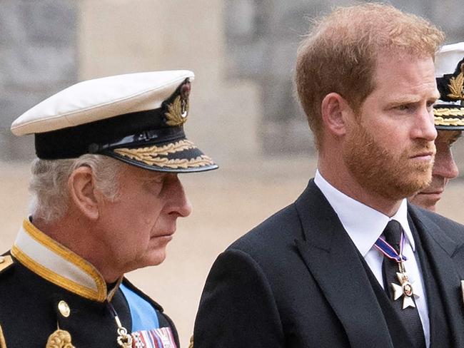 Britain's King Charles III (L) walks with his son Britain's Prince Harry, Duke of Sussex as they arrive at St George's Chapel inside Windsor Castle on September 19, 2022, ahead of the Committal Service for Britain's Queen Elizabeth II. - Monday's committal service is expected to be attended by at least 800 people, most of whom will not have been at the earlier State Funeral at Westminster Abbey. (Photo by David Rose / POOL / AFP)