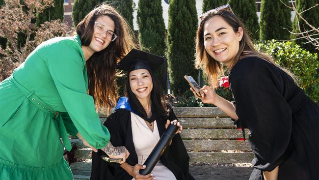 Master of Science graduate Aline dos Passos Silva with friends Luiza Sartori (left) and Marcela Reis at her UniSQ graduation ceremony at Empire Theatres, Wednesday, June 28, 2023. Picture: Kevin Farmer