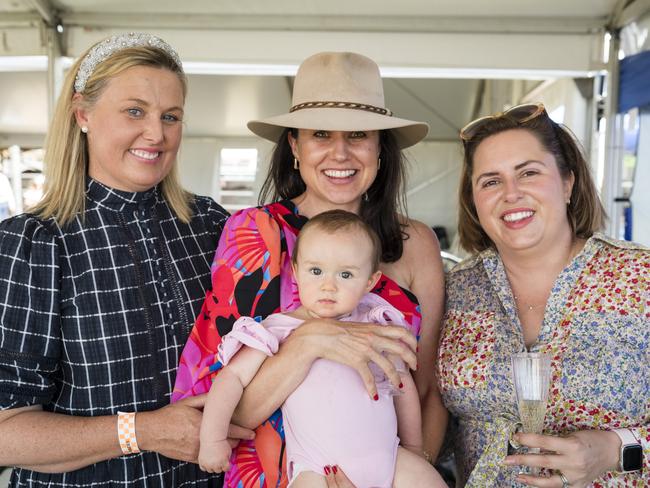 At the Clifton Races are (from left) Belinda Warby, Stevie McMurtie, holding her baby daughter Ella Johnson, and Sally Hughes, Saturday, October 28, 2023. Picture: Kevin Farmer